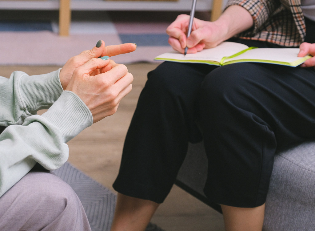 Mental Health Evaluations female therapist with client